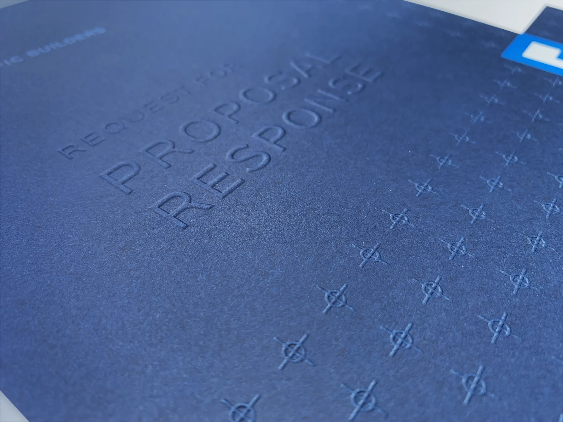 A close up of a blue book with writing on it